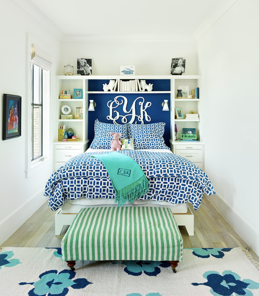 tween bedroom with built in bookshelf headboard and monogrammed wall letters