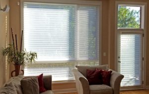 white sheer shades on large living room window and entryway door in Chicago IL