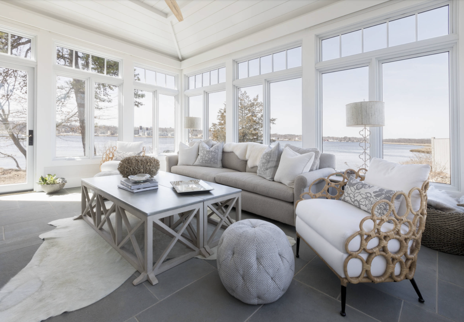 coastal themed sunroom with curved furniture