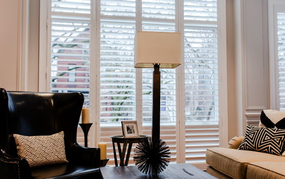 living room in Chicago with floor to ceiling shutters