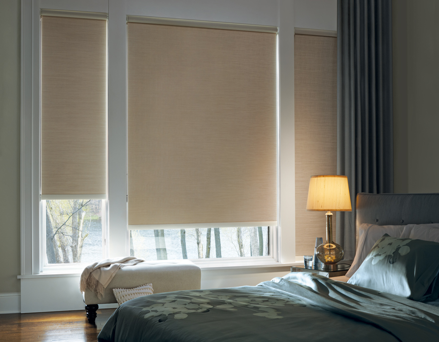 beautifully decorated bedroom with blackout roller shades in Chicago