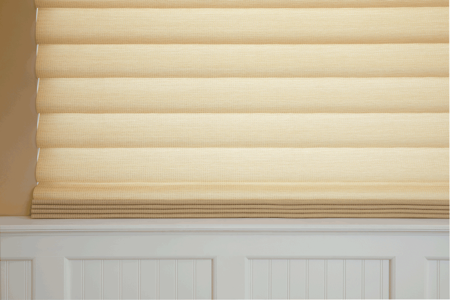 Close up of modern roman shades used to rid the glare.