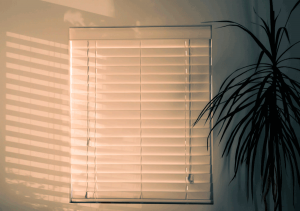 outdated blinds with dangling blind cords
