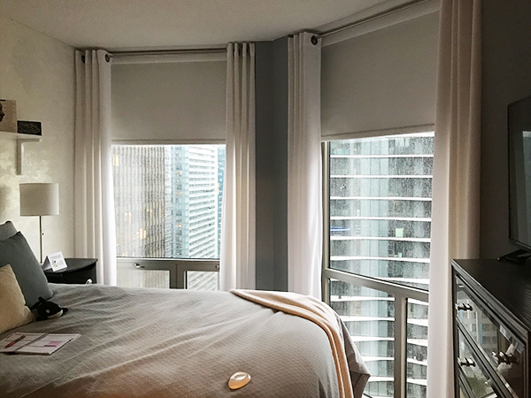 bedroom with motorized blinds skyline window coverings