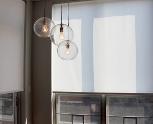 white roller shades with modern lighting in Chicago IL