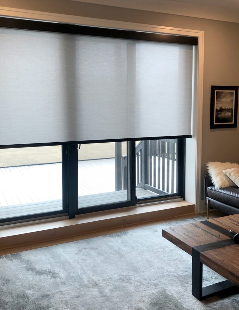 gray roller shades over black frame sliding doors in Chicago IL