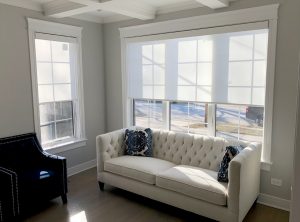 white roller shades in Chicago IL living room with white couch