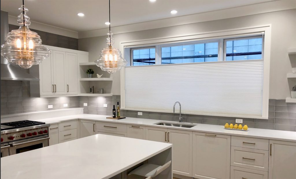 top down shades on kitchen window behind sink in modern white kitchen