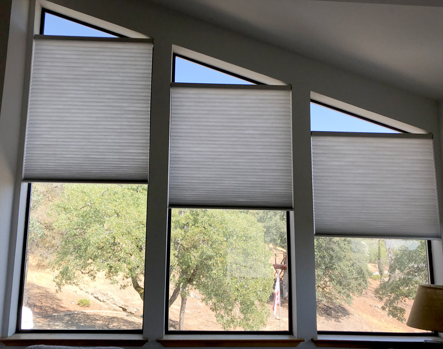 angled windows with shades for specialty shapes 