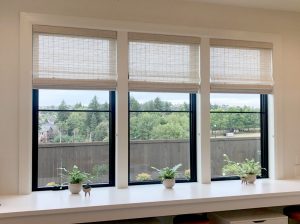three windows in Portland home with woven wood shades