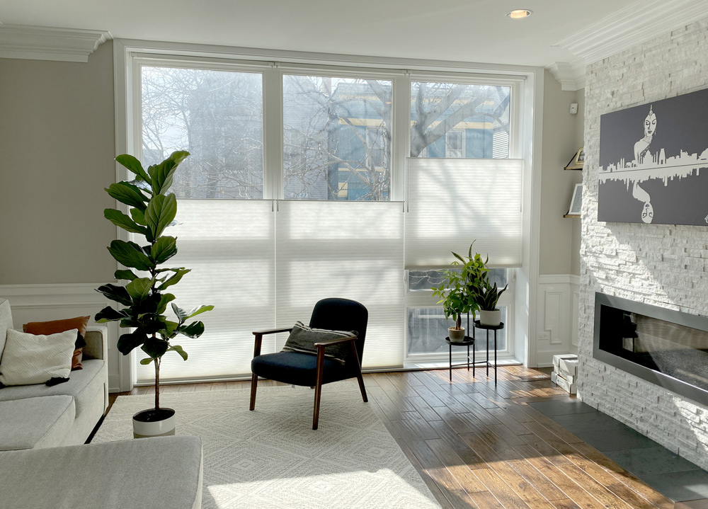 top down bottom up shades in cozy living room white duette honeycomb shades floor to ceiling windows Chicago IL