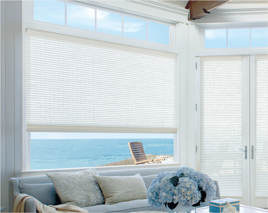 Window treatments covering large window in living room.