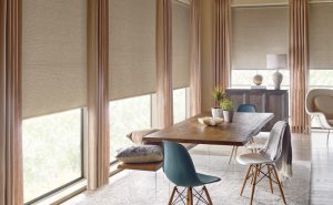 designer roller shades with drapery panels in dining room Chicago 60614