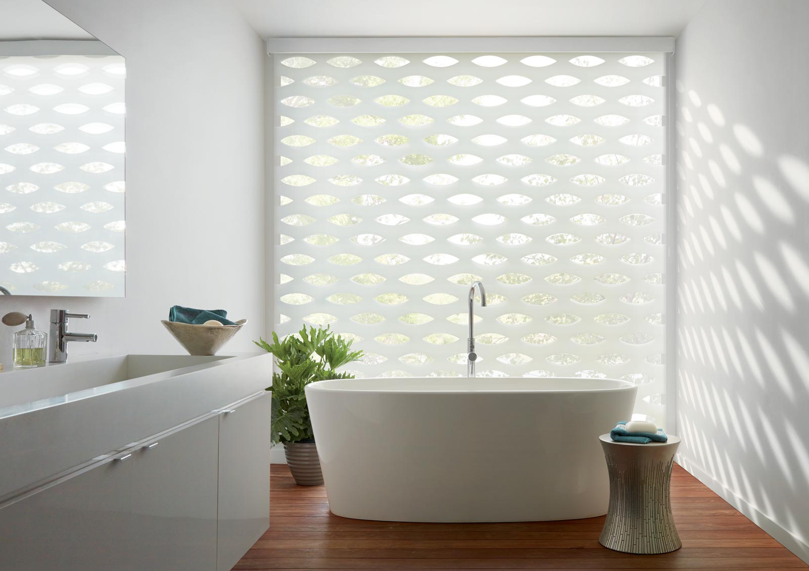 floor to ceiling window in Winnetka bathroom with white roller shades in geometric designs