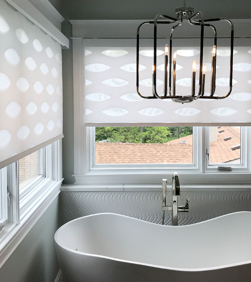 designer banded shades in the corner of master bathroom