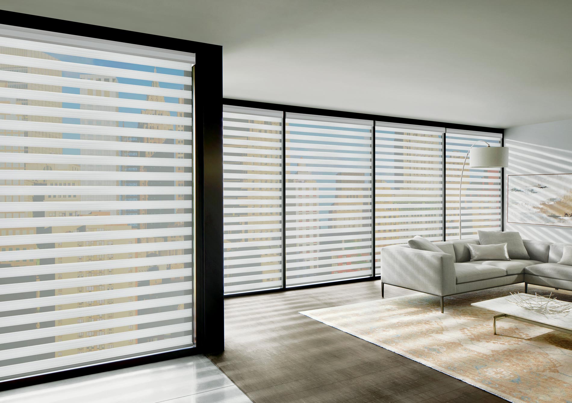 white layered shades on wall to wall floor to ceiling windows in Chicago IL