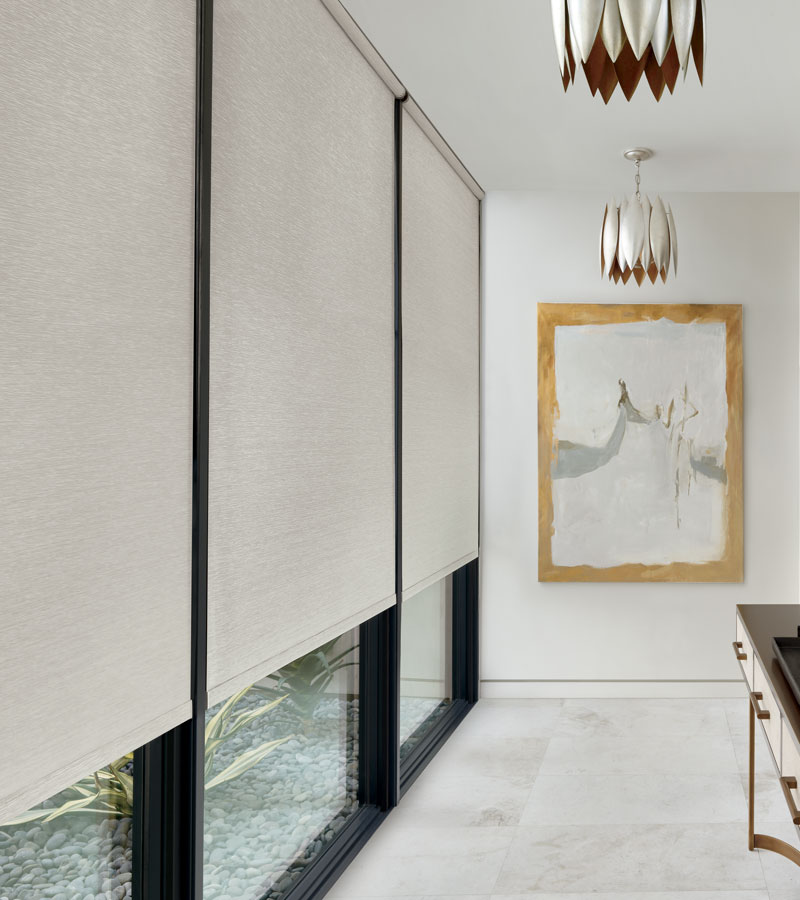 hallway with floor to ceiling windows and soft neutral roller screen shades with automated control in Chicago IL