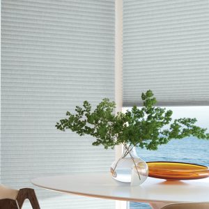 corner of dining room floor to ceiling windows with duette honeycomb shades Vancouver WA