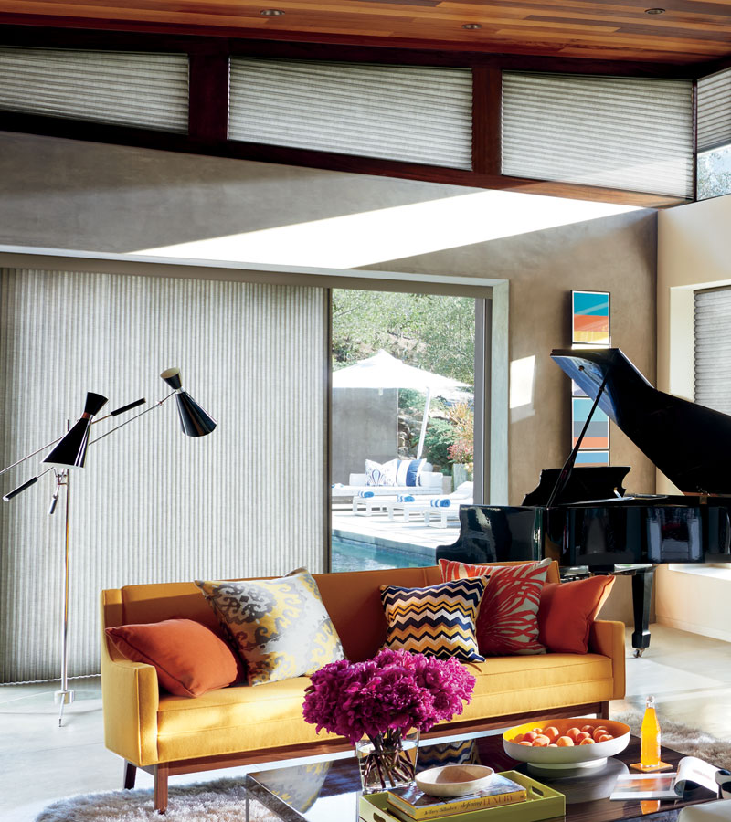 gray honeycomb shades on angled windows and vertical cellular shades on sliding doors in Portland OR