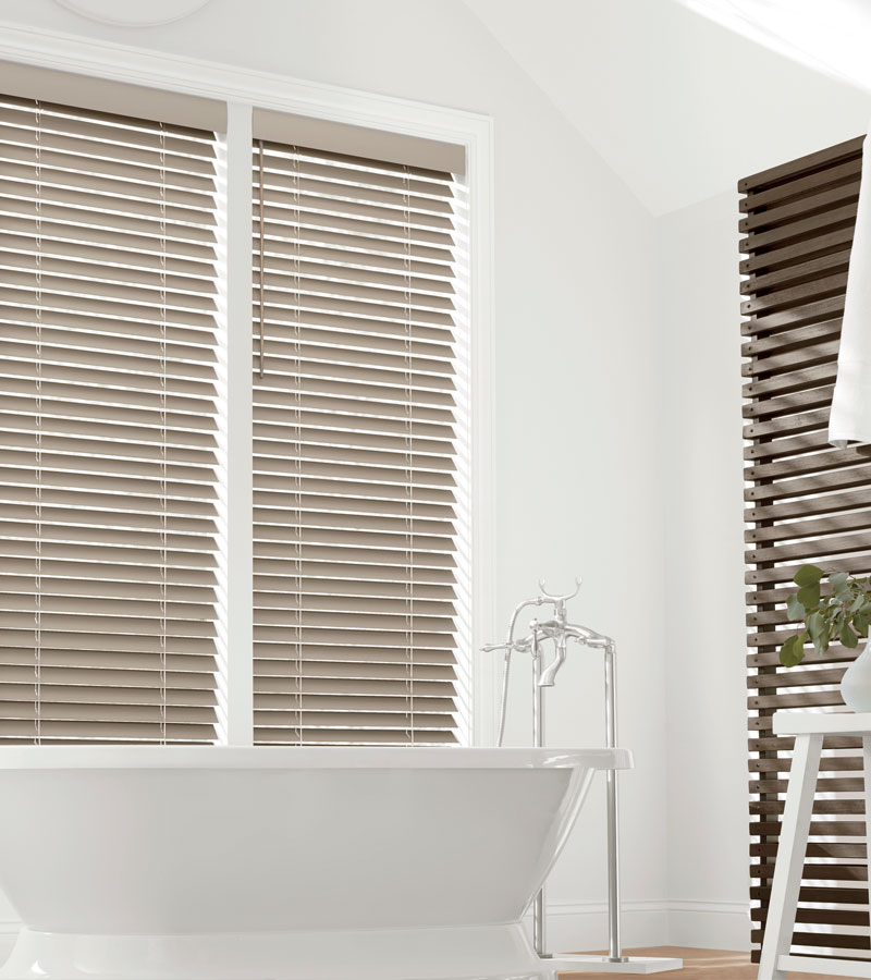 medium wood faux wood blinds in bathroom in Portland OR