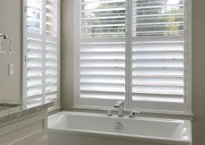Vancouver WA bathroom with white shutters for privacy