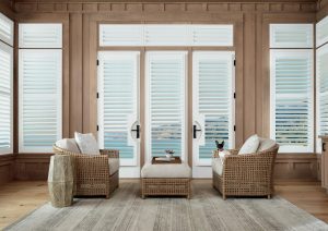 sunroom with white plantation shutters and wooden paneling in Camas WA