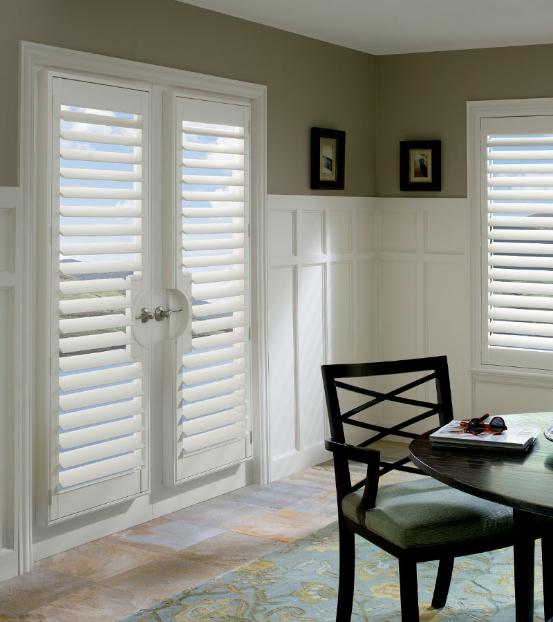 dining room with white interior shutters on french doors in Naperville IL home