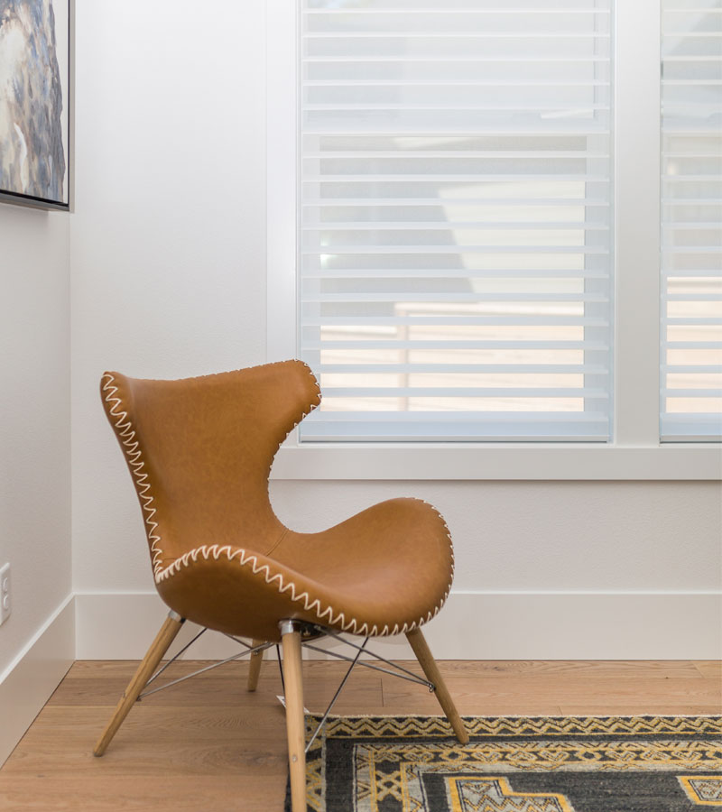 leather chair with white sheer shades in Portland OR