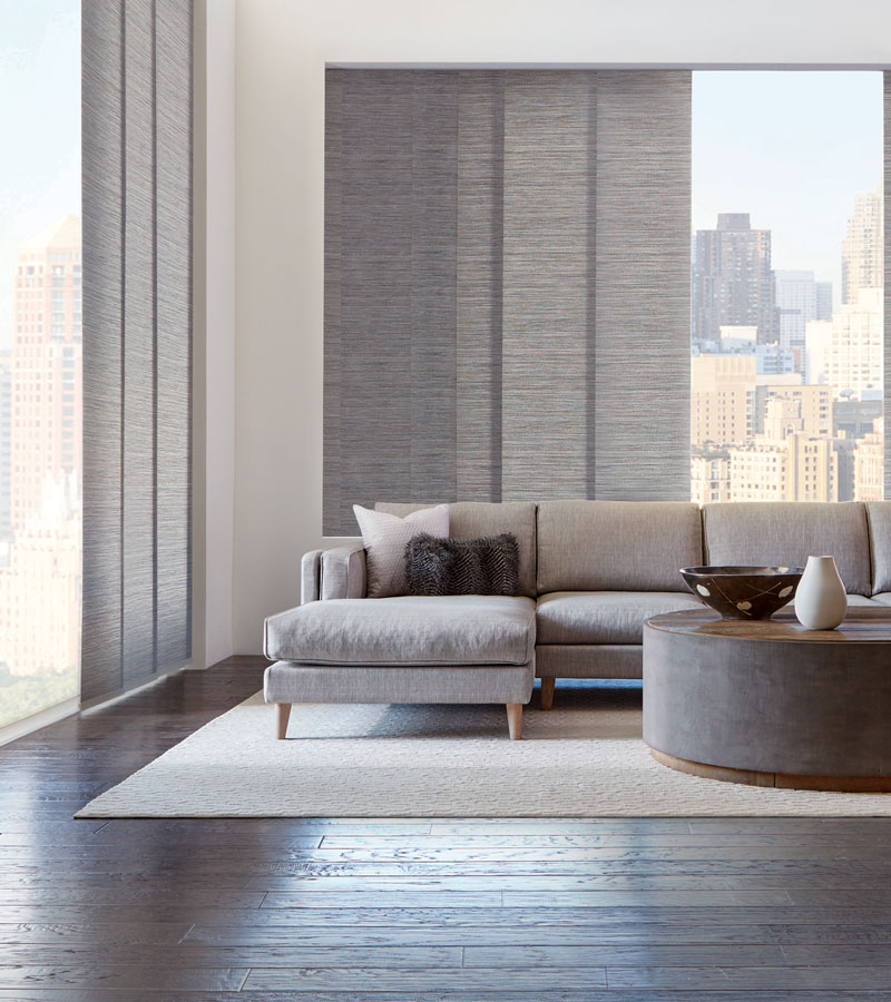 gray vertical shades on floor to ceiling windows in downtown Chicago condo