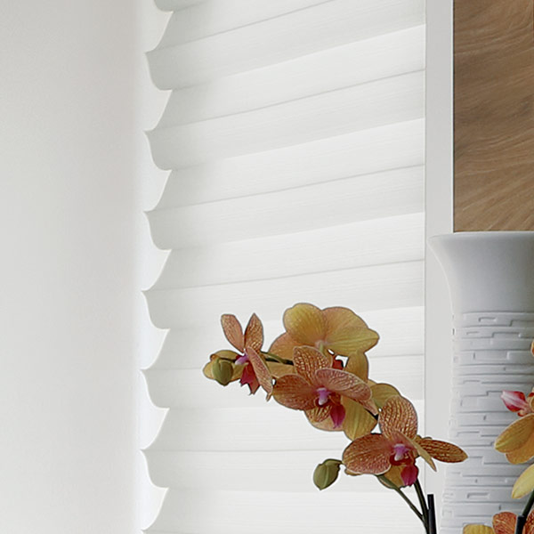 white fabric solera roman shades for light filtering and energy savings in Naperville IL
