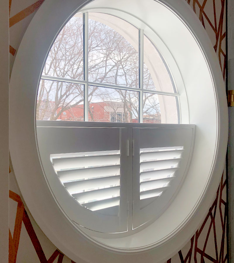 custom shaped window treatments plantation shutters on round window in Chicago IL