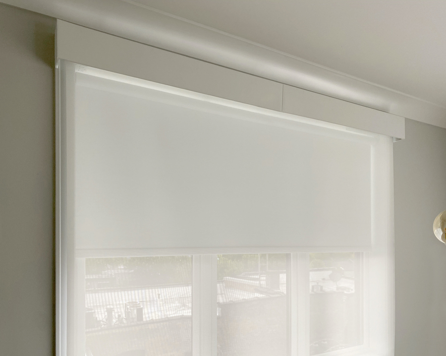 dual roller shades with blackout shades dropping into place in Chicago IL home