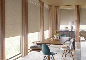 large dining room with taupe roller shades and coordinated draperies in Portland OR