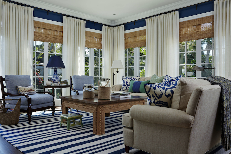 striped blue and white living room with woven shades