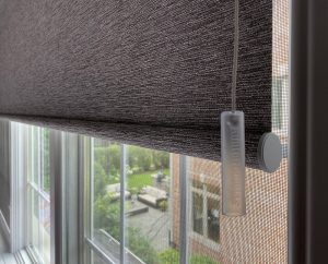 close up of window with brown textured roller shades Chicago IL