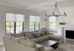 living room with light gray roller shades on black frame windows in Hinsdale IL