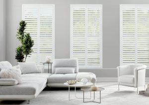 hunter douglas newstyle composite shutters in white living room Hinsdale IL