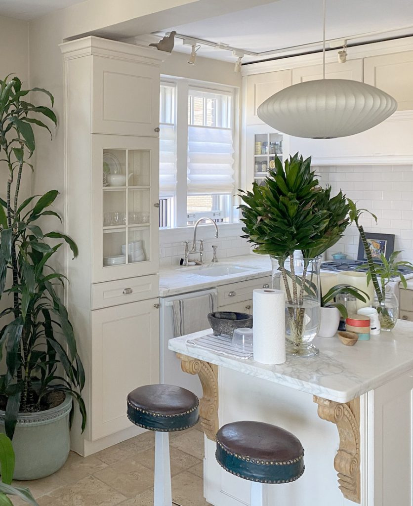 white roman shades above kitchen sink in Chicago 60657