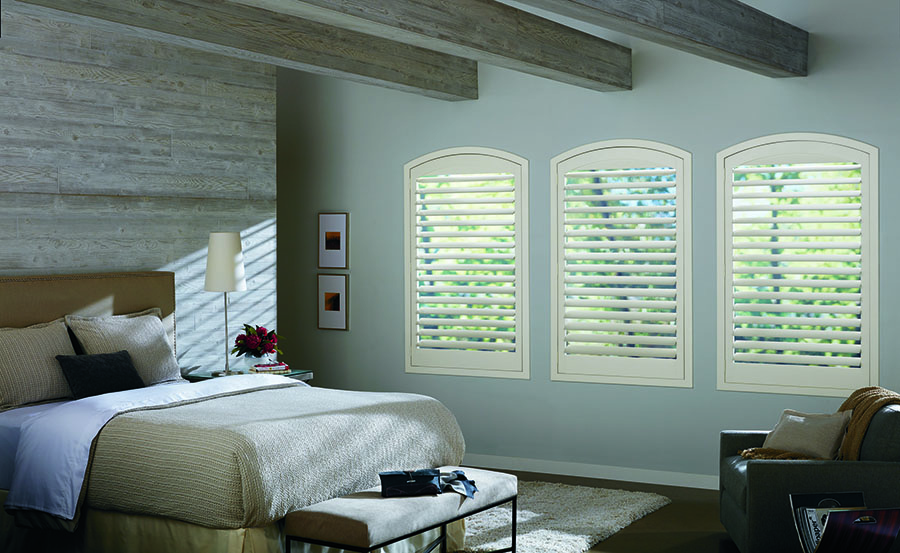 arched windows with shutters bring character in bedroom design tips