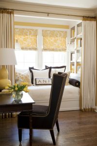 Yellow shades in bay window in kitchen.