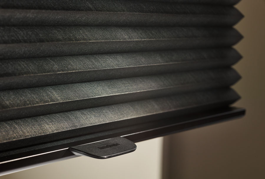 detail of these fabric cellular shades in dark ebony color