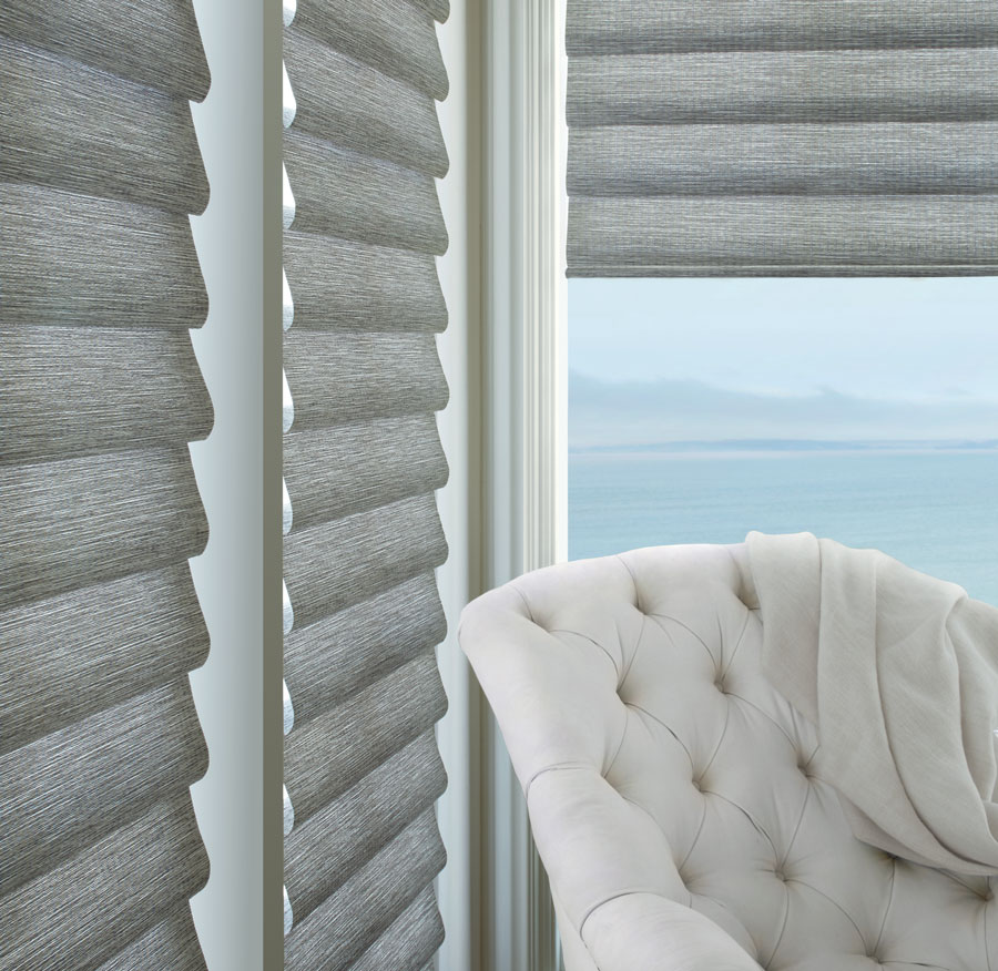 gray roman shades in corner window in white living room in Chicago, IL 60618