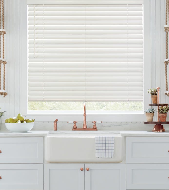 white kitchen with rose gold accents and over the sink window blinds Chicago, IL 60618