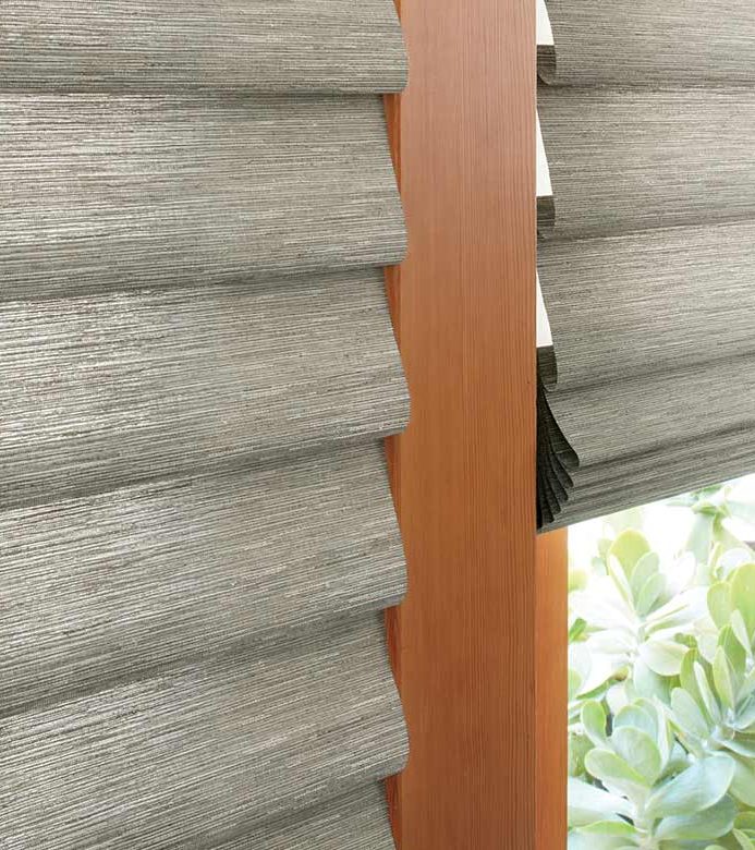 gray roman shades on glass patio doors