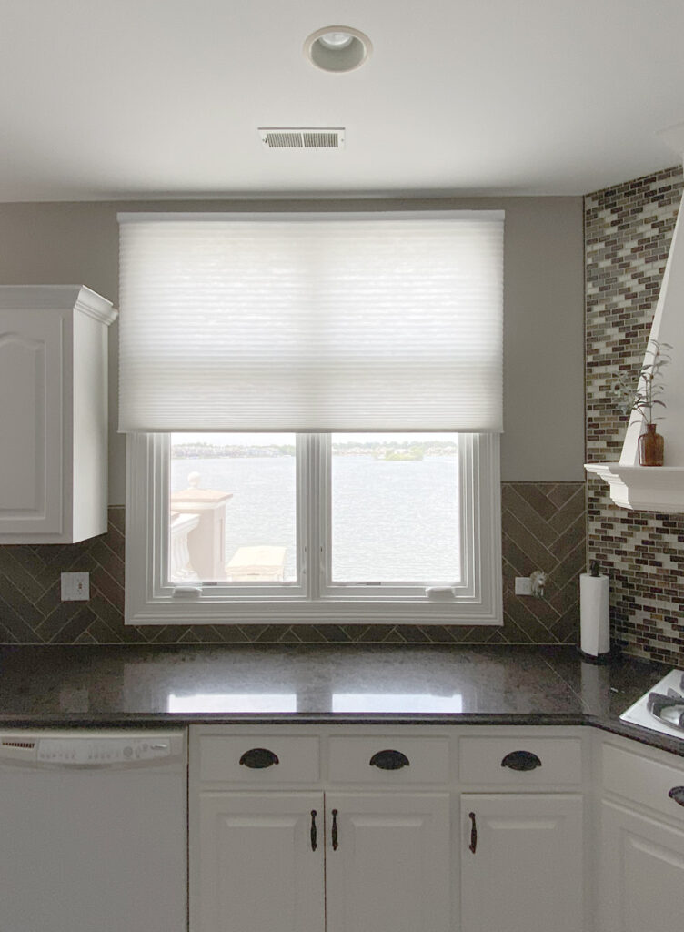 white kitchen with honeycomb shade