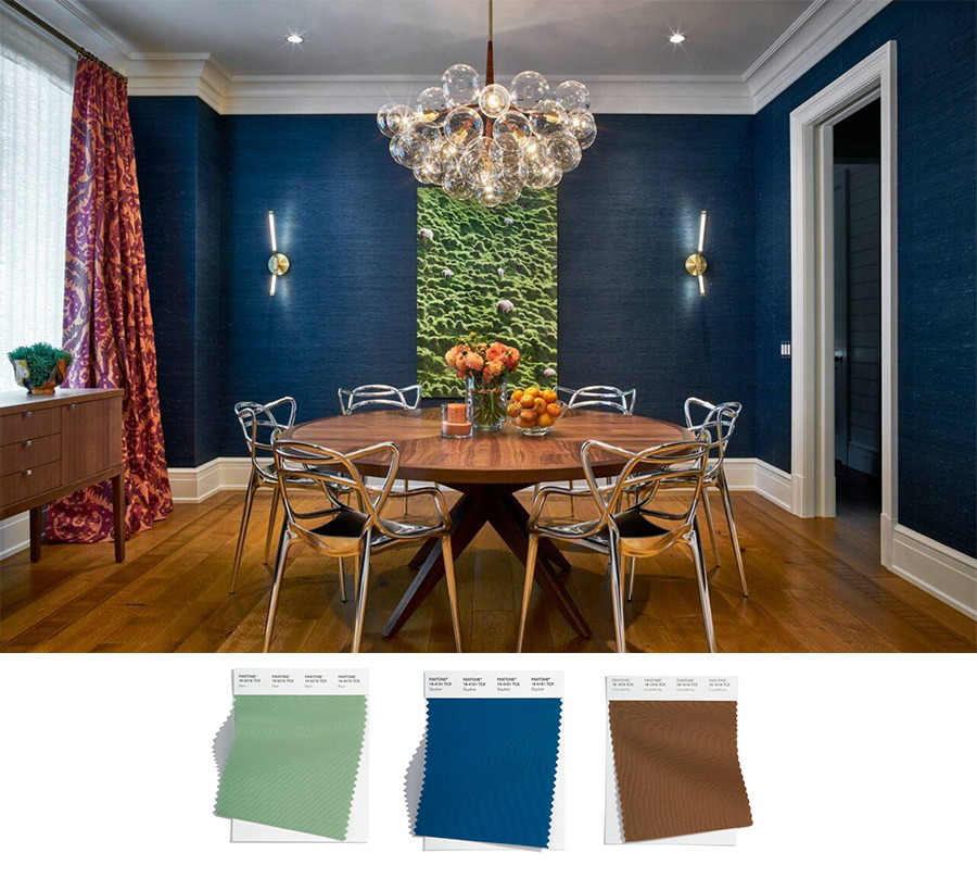 blue grasscloth walls in modern dining room with wooden table and hardwood floors