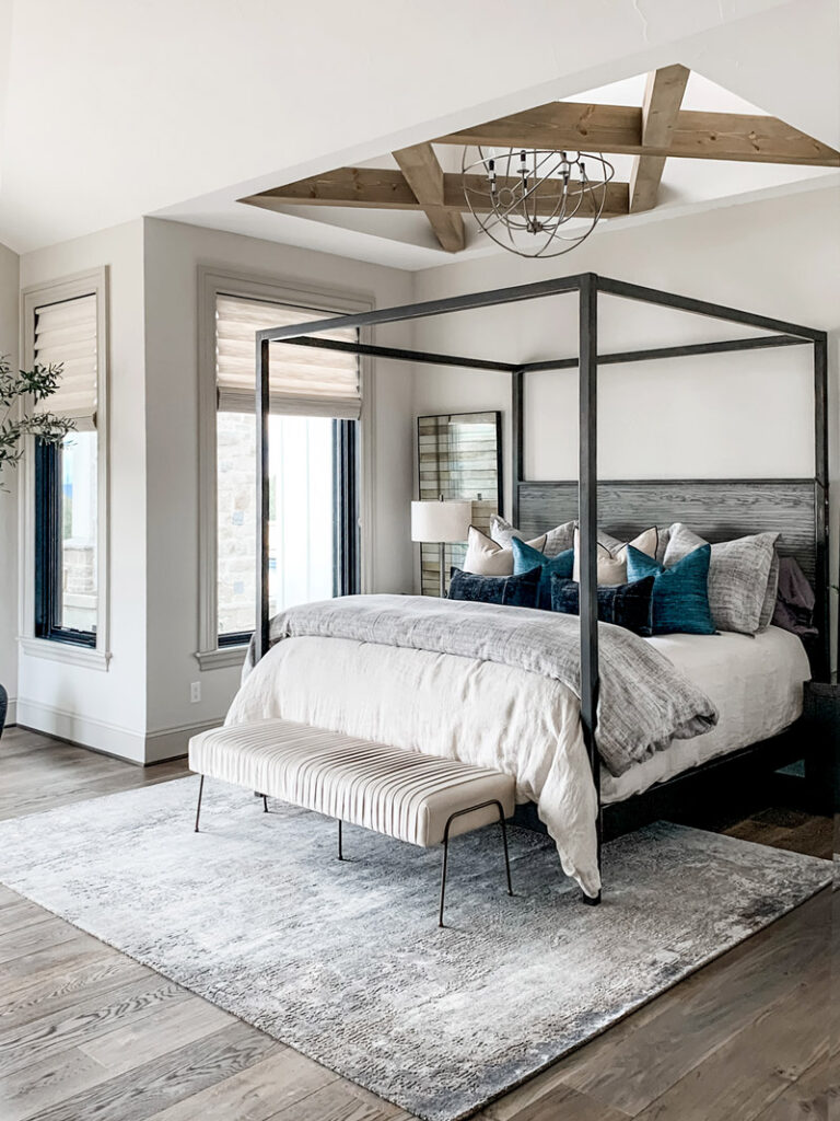 soft beige fabric roman shades in master bedroom