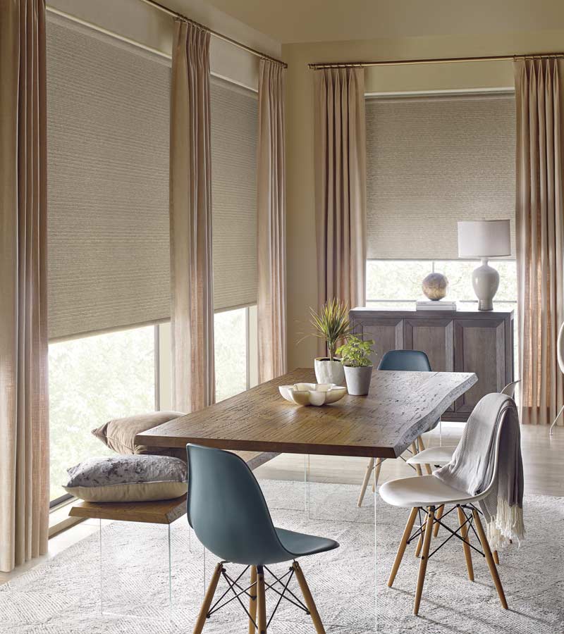 neutral dining room with beige draperies and beige shades