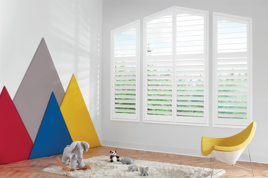 Playroom with interior shutters on angled windows