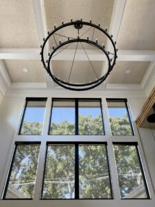 Tall windows with black screen shades